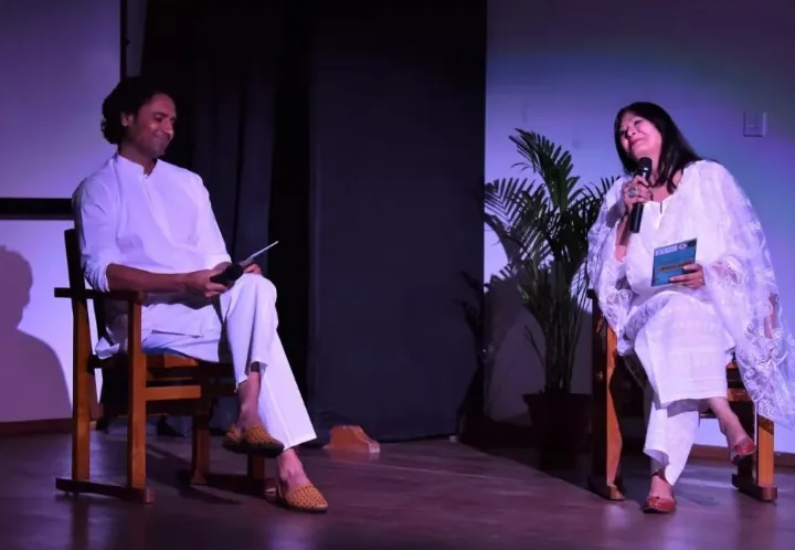 An intimate fireside literary conversation between two guests